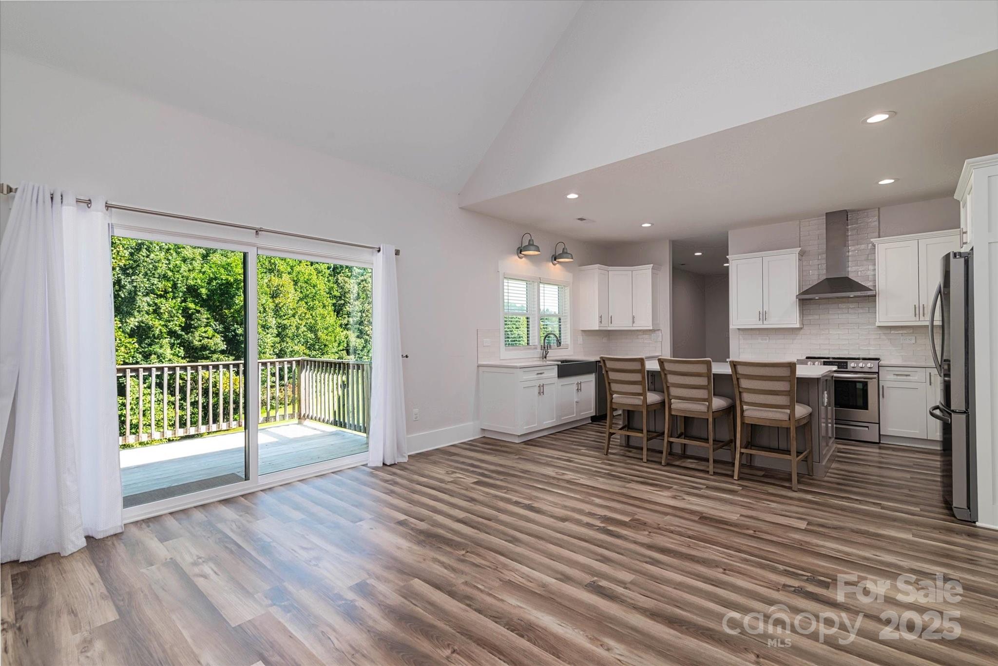 5345 Christopher Road Iron Station, NC 28080 - Photo 13 of 48 a view of a dining room with furniture and wooden floor