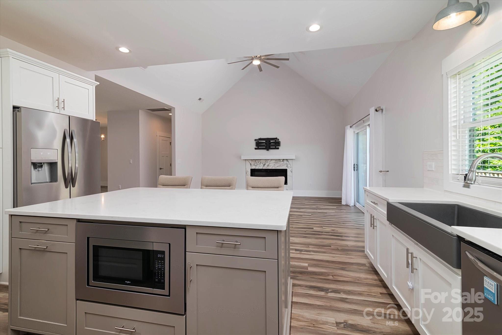 5345 Christopher Road Iron Station, NC 28080 - Photo 16 of 48 a kitchen with kitchen island a sink stove and refrigerator