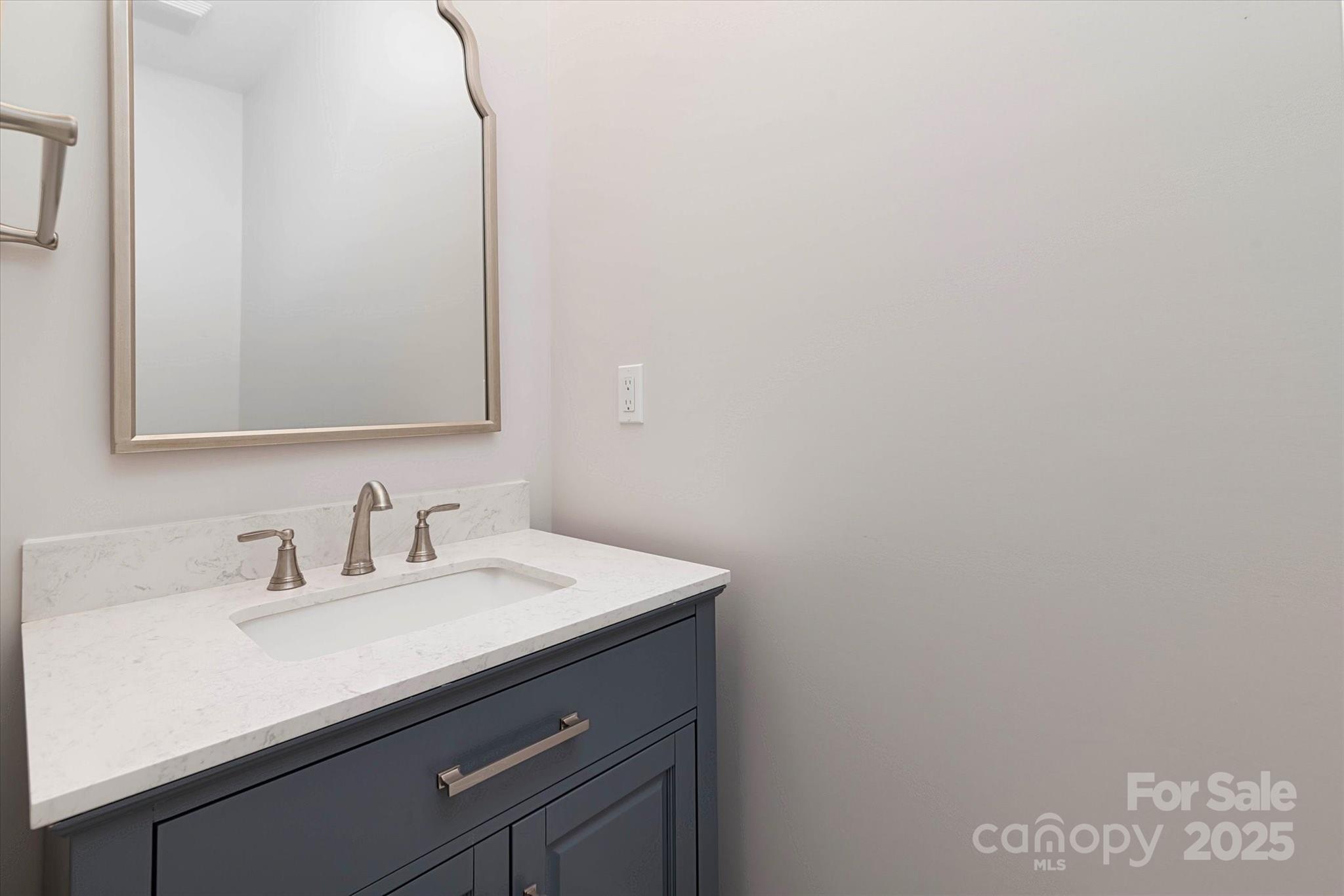 5345 Christopher Road Iron Station, NC 28080 - Photo 23 of 48 a bathroom with a sink and a mirror