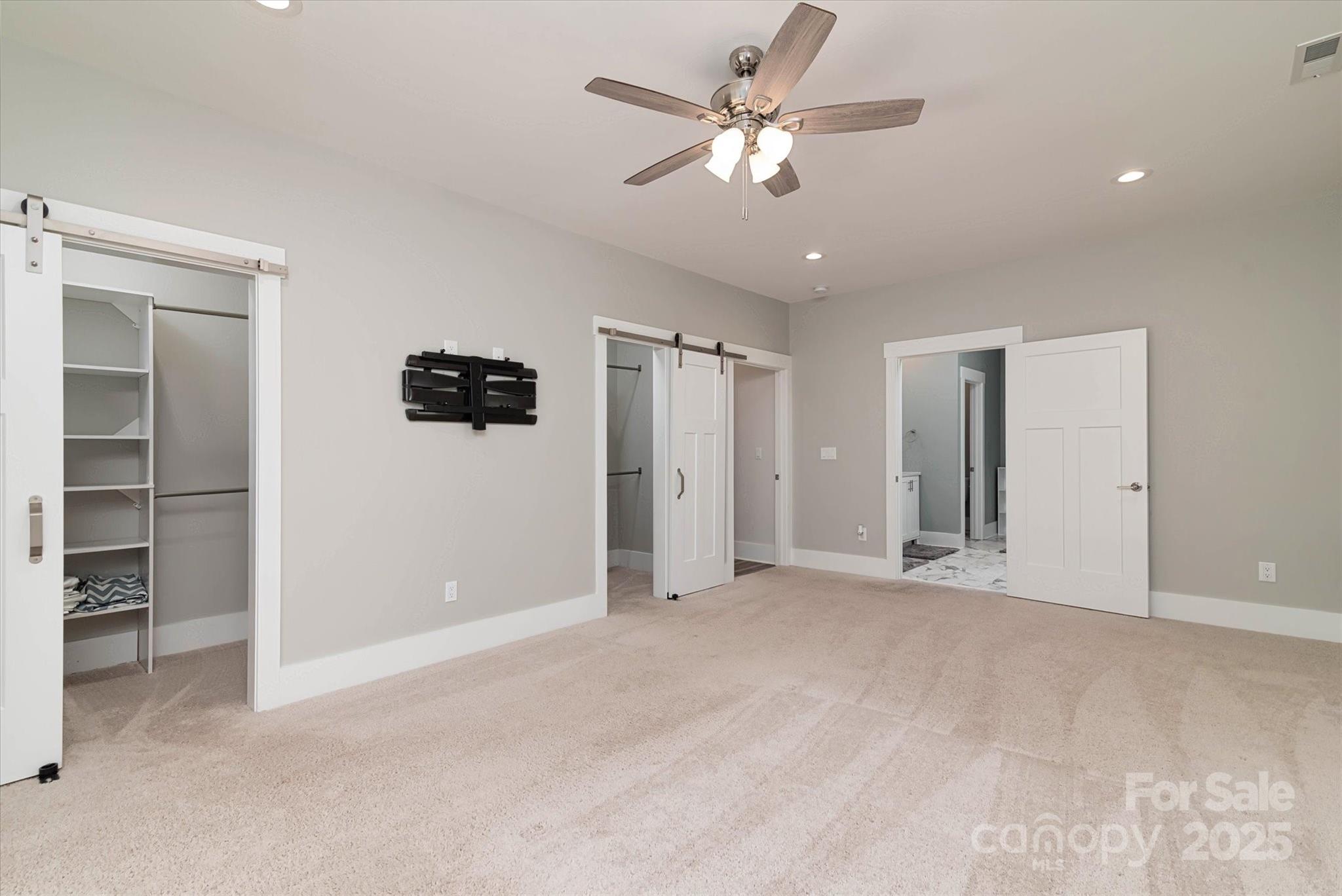 5345 Christopher Road Iron Station, NC 28080 - Photo 26 of 48 a view of an empty room with a ceiling fan