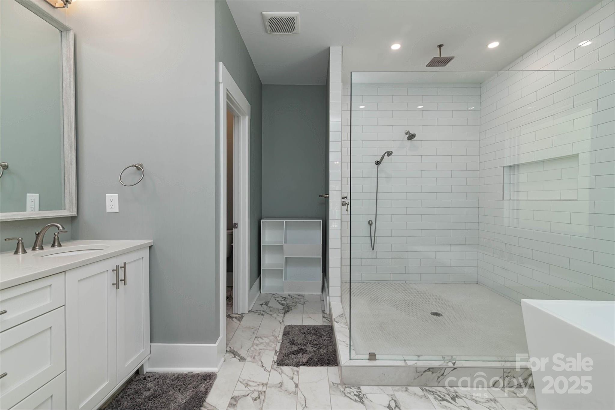 5345 Christopher Road Iron Station, NC 28080 - Photo 27 of 48 a bathroom with a shower and a sink