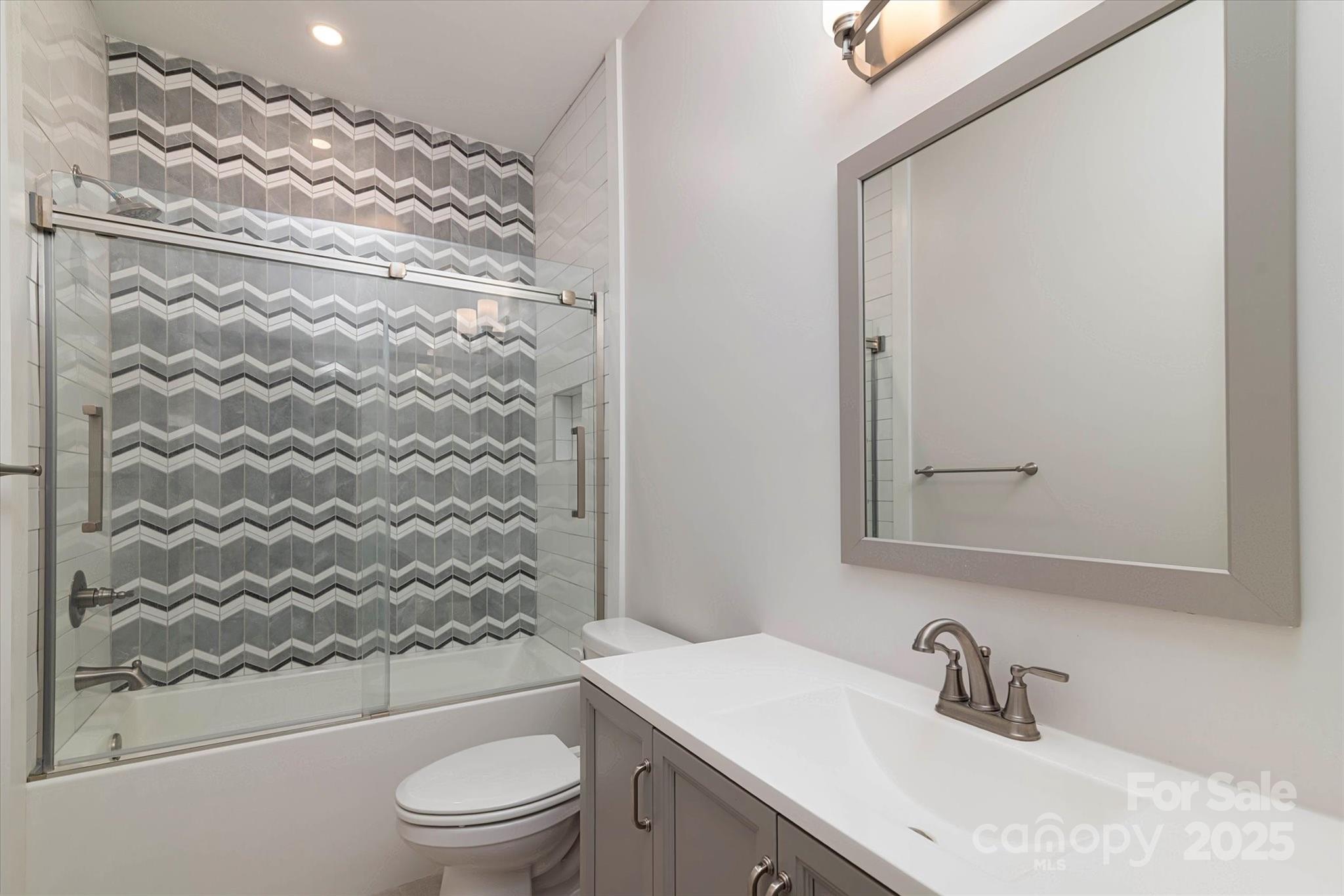 5345 Christopher Road Iron Station, NC 28080 - Photo 33 of 48 a bathroom with a sink toilet and shower