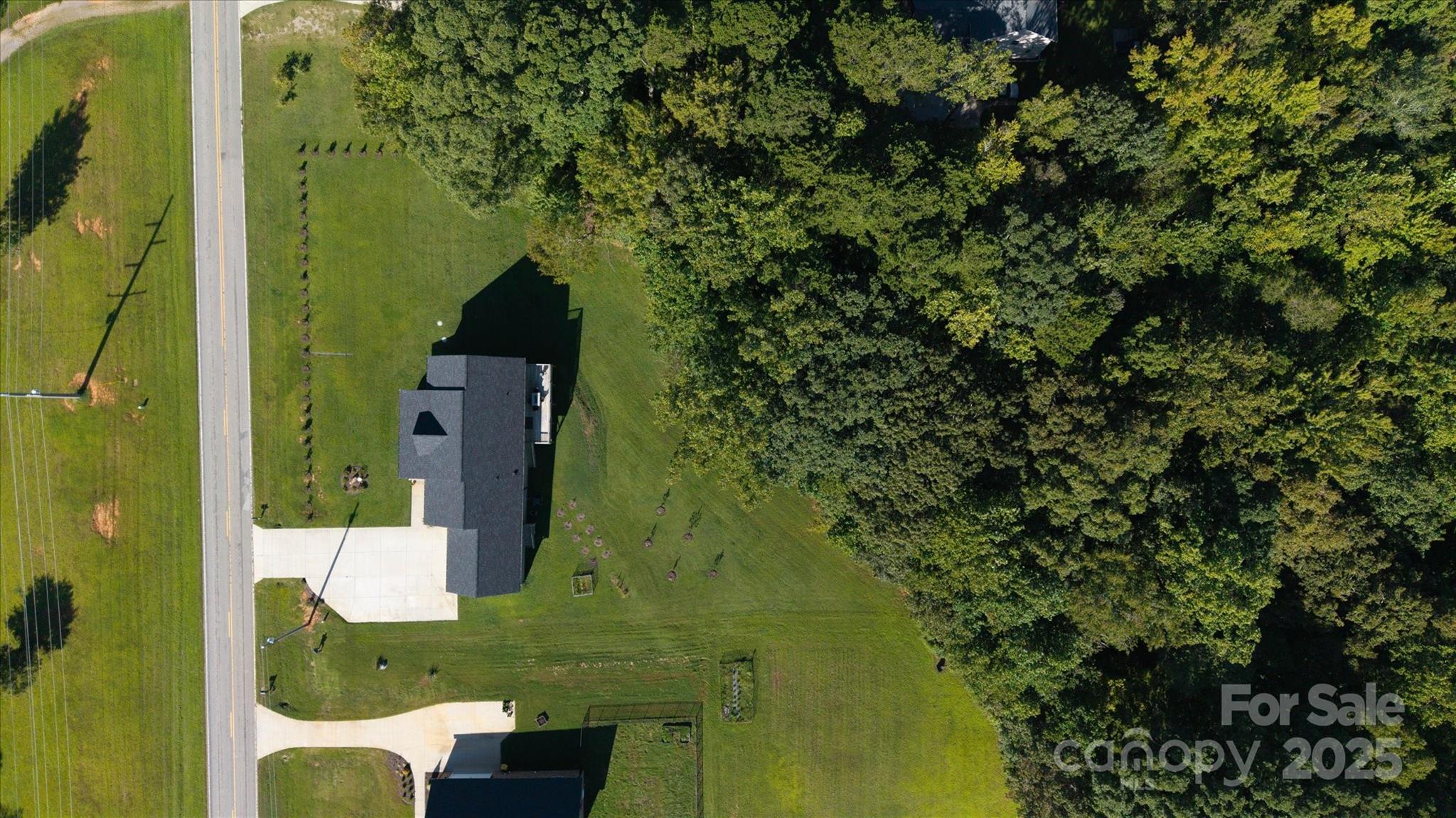 5345 Christopher Road Iron Station, NC 28080 - Photo 48 of 48 an aerial view of residential house with outdoor space and trees