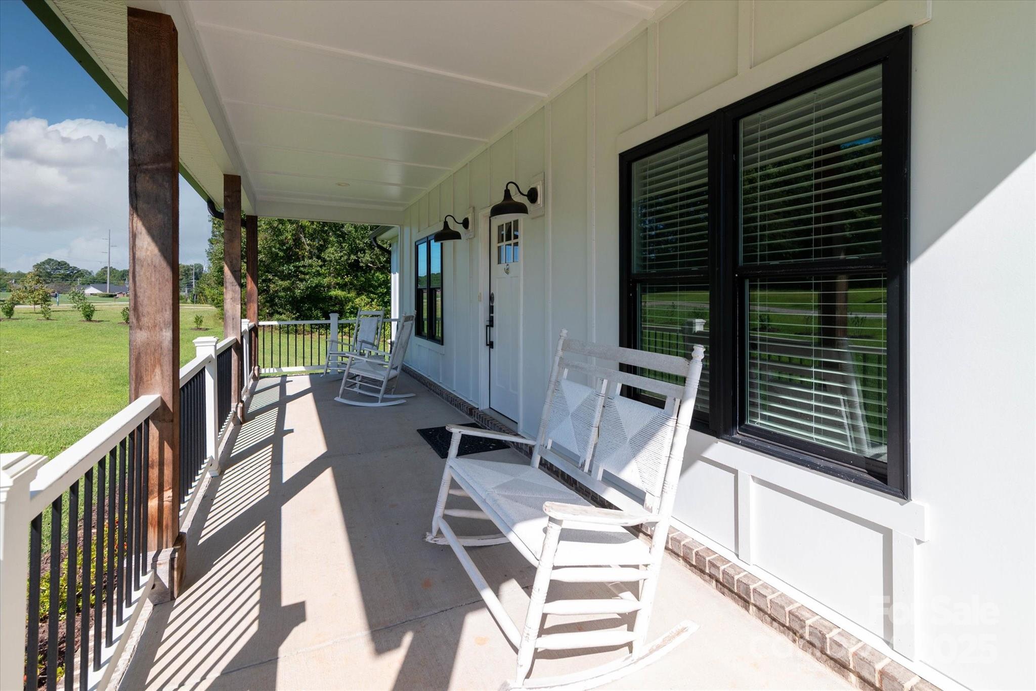 5345 Christopher Road Iron Station, NC 28080 - Photo 6 of 48 a view of balcony with wooden floor and outdoor seating