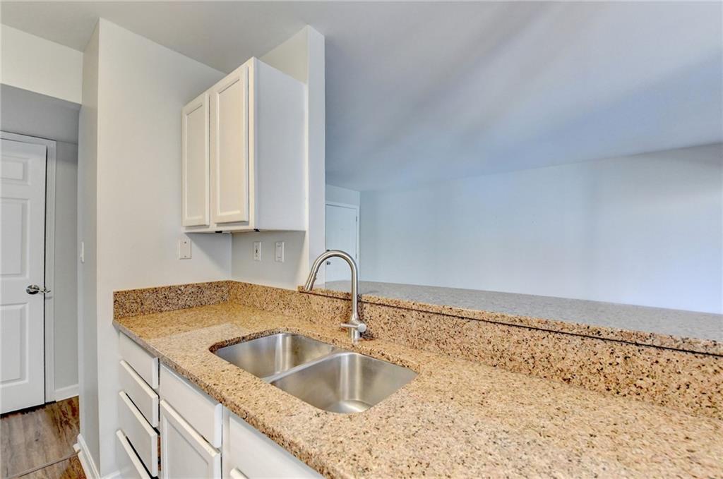 911 Garden Court, Unit 911 Atlanta, GA 30328 - Photo 17 of 41 a close view of sink and tap