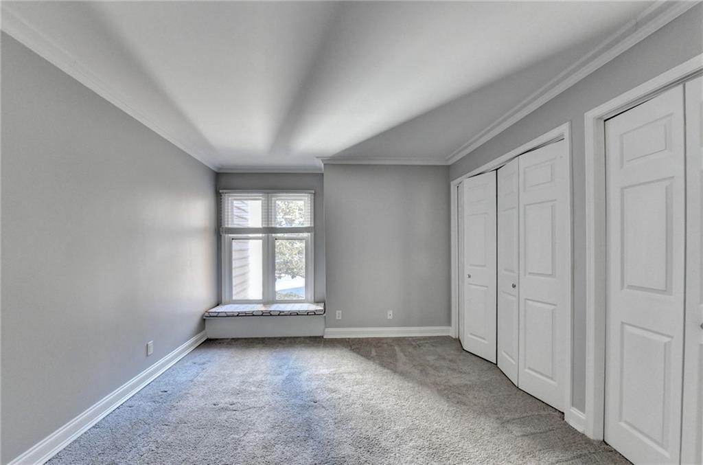 911 Garden Court, Unit 911 Atlanta, GA 30328 - Photo 22 of 41 an empty room with windows
