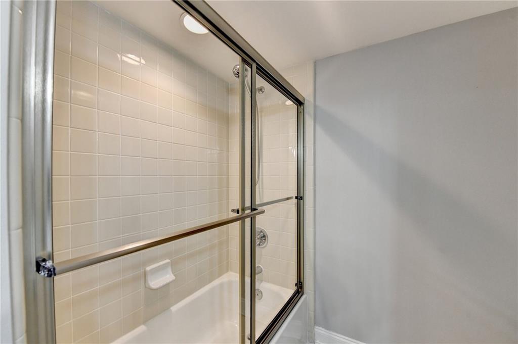 911 Garden Court, Unit 911 Atlanta, GA 30328 - Photo 25 of 41 a bathroom with a shower