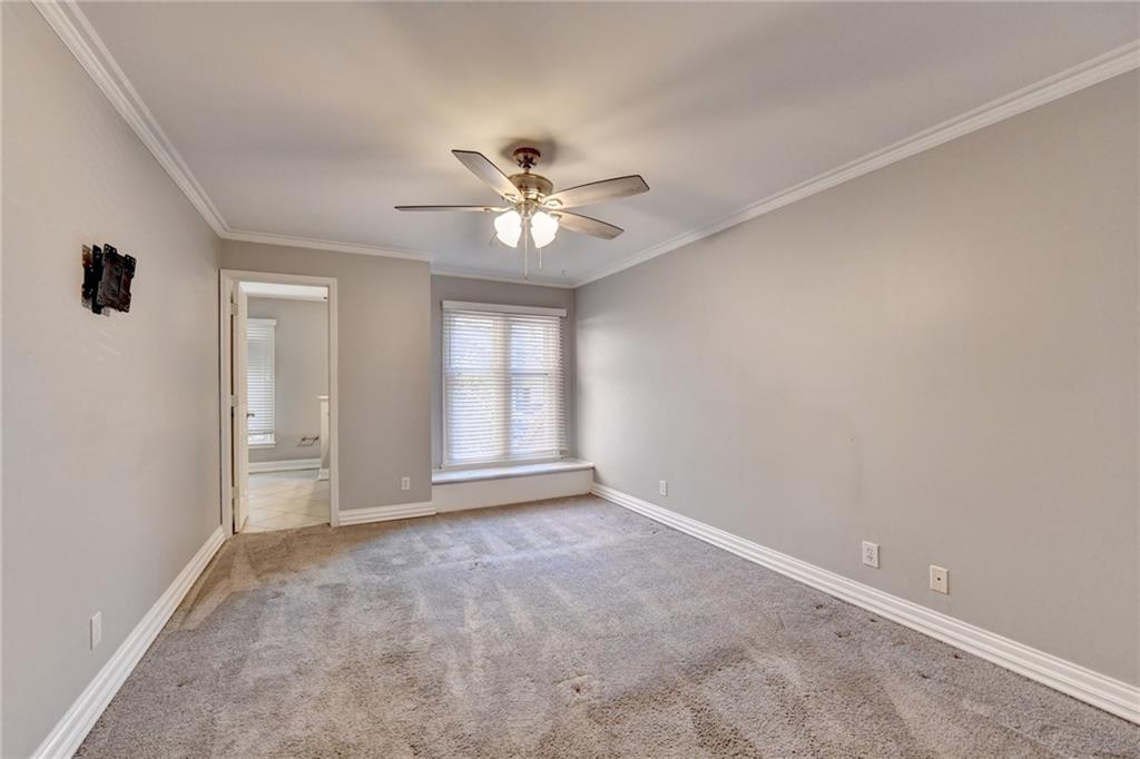 911 Garden Court, Unit 911 Atlanta, GA 30328 - Photo 26 of 41 a view of an empty room with a window
