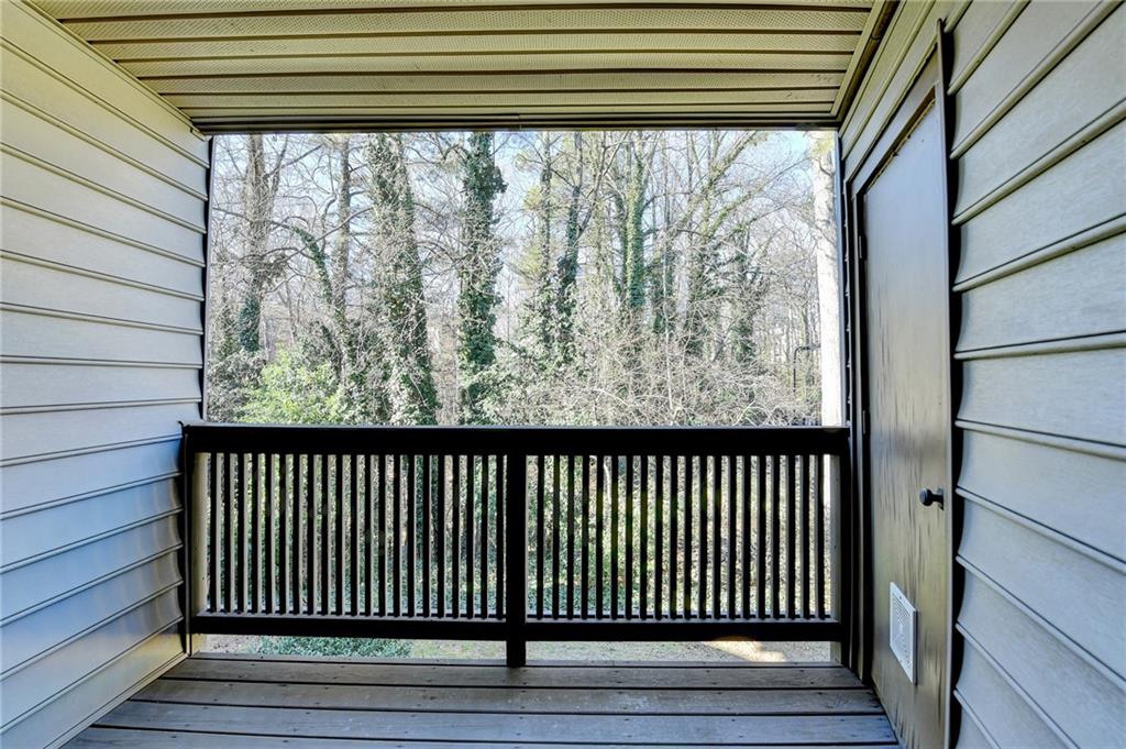911 Garden Court, Unit 911 Atlanta, GA 30328 - Photo 34 of 41 a view of a wooden balcony