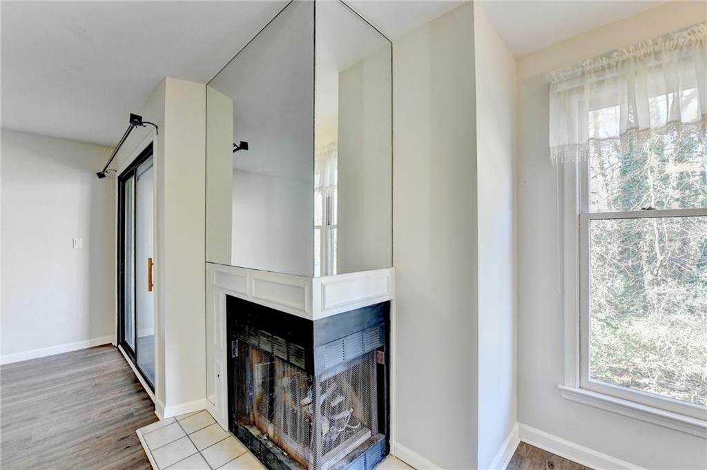 911 Garden Court, Unit 911 Atlanta, GA 30328 - Photo 10 of 41 a view of a hallway with wooden floor and staircase