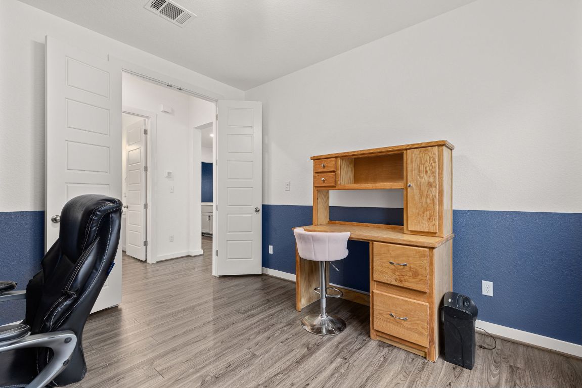 317 Independence Drive Kyle, TX 78640 - Photo 26 of 40 The details really make a difference. The double doors add a touch of sophistication while also allowing you to close off the space when you need some quiet.