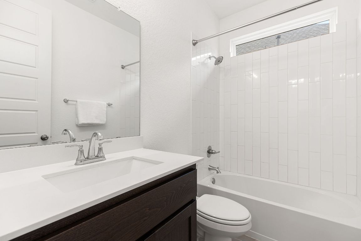 317 Independence Drive Kyle, TX 78640 - Photo 27 of 40 The shared bathrooms maintain that same crisp, modern feel but take it a step further with thoughtful details.