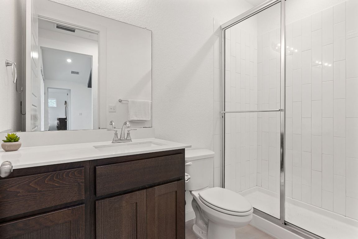 317 Independence Drive Kyle, TX 78640 - Photo 34 of 40 The shared bathrooms maintain that same crisp, modern feel but take it a step further with thoughtful details.