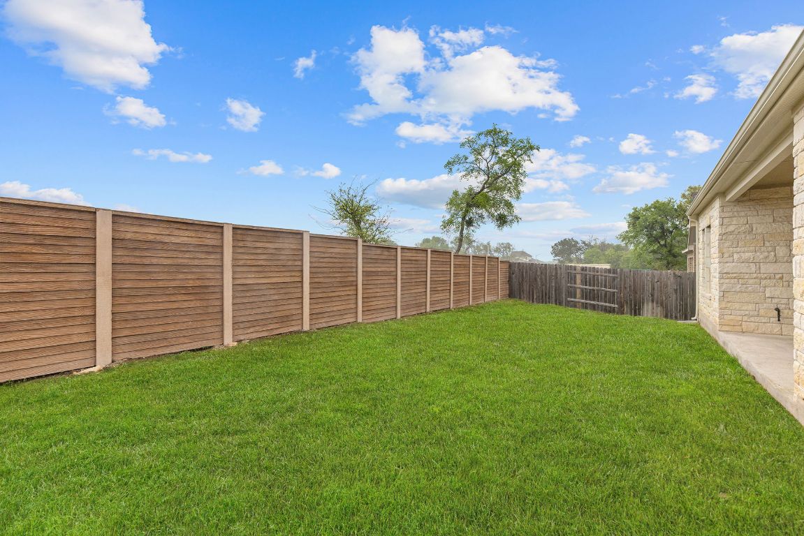 317 Independence Drive Kyle, TX 78640 - Photo 40 of 40 Ready to make this backyard yours? This home is calling your name—schedule your visit today!
