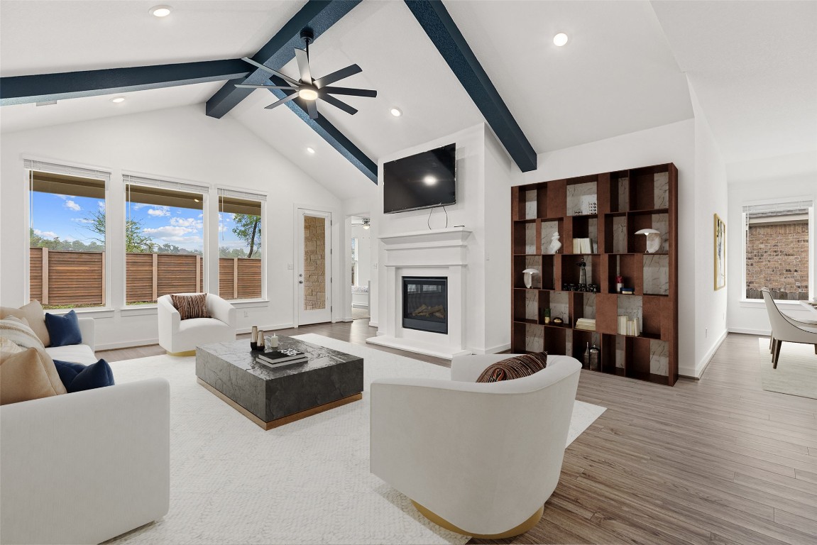 317 Independence Drive Kyle, TX 78640 - Photo 8 of 40 The space is flooded with natural light, thanks to the wall of windows overlooking the backyard. It’s the kind of room where you can truly unwind.
*virtually staged*