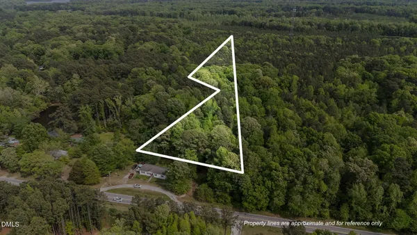 a aerial view of a house with a yard