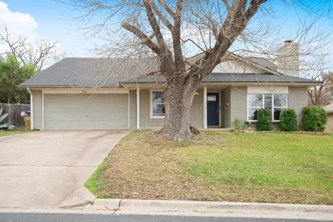 front view of a house with a dry yard
