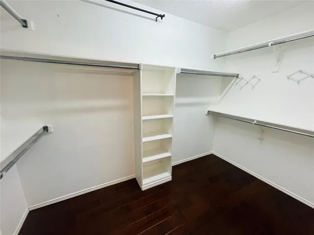 a view of an empty walk in closet