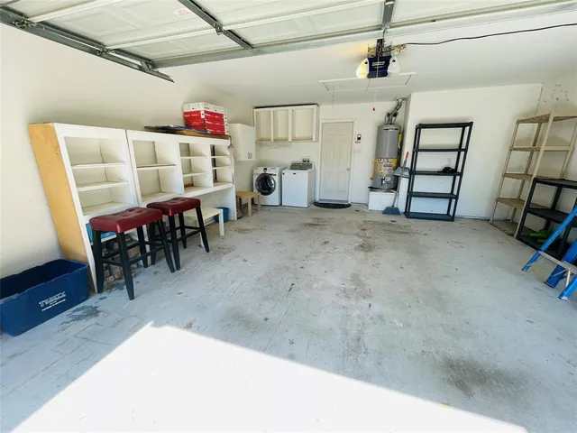 a view of a livingroom with furniture and a ceiling fan