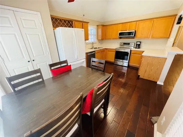 a living room with a couch and wooden floor