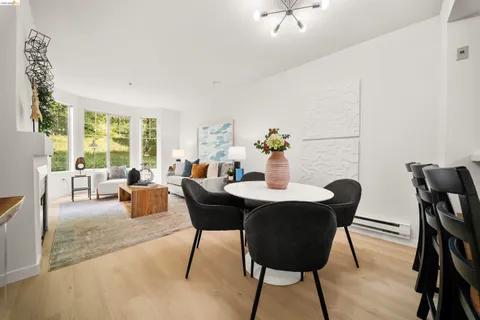 a view of a dining room with furniture window and outside view