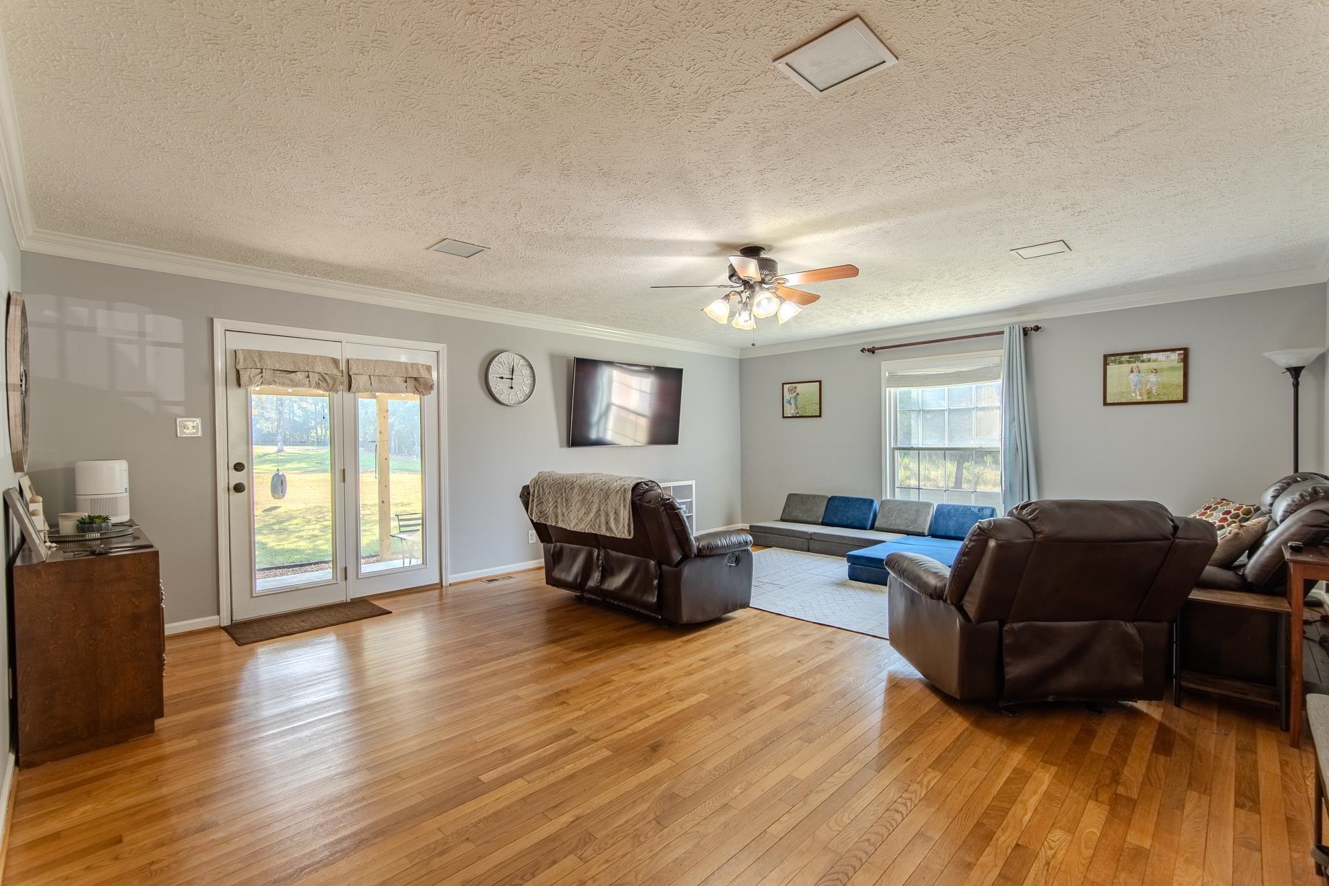 1320 Rich Road Savannah, TN 38372 - Photo 9 of 39 a living room with furniture and a wooden floor
