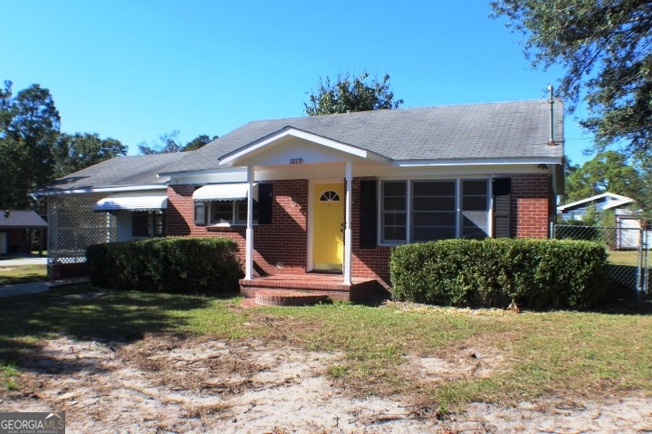 217 Fowler Street Swainsboro, GA 30401 - Photo 1 of 1 a front view of a house with garden
