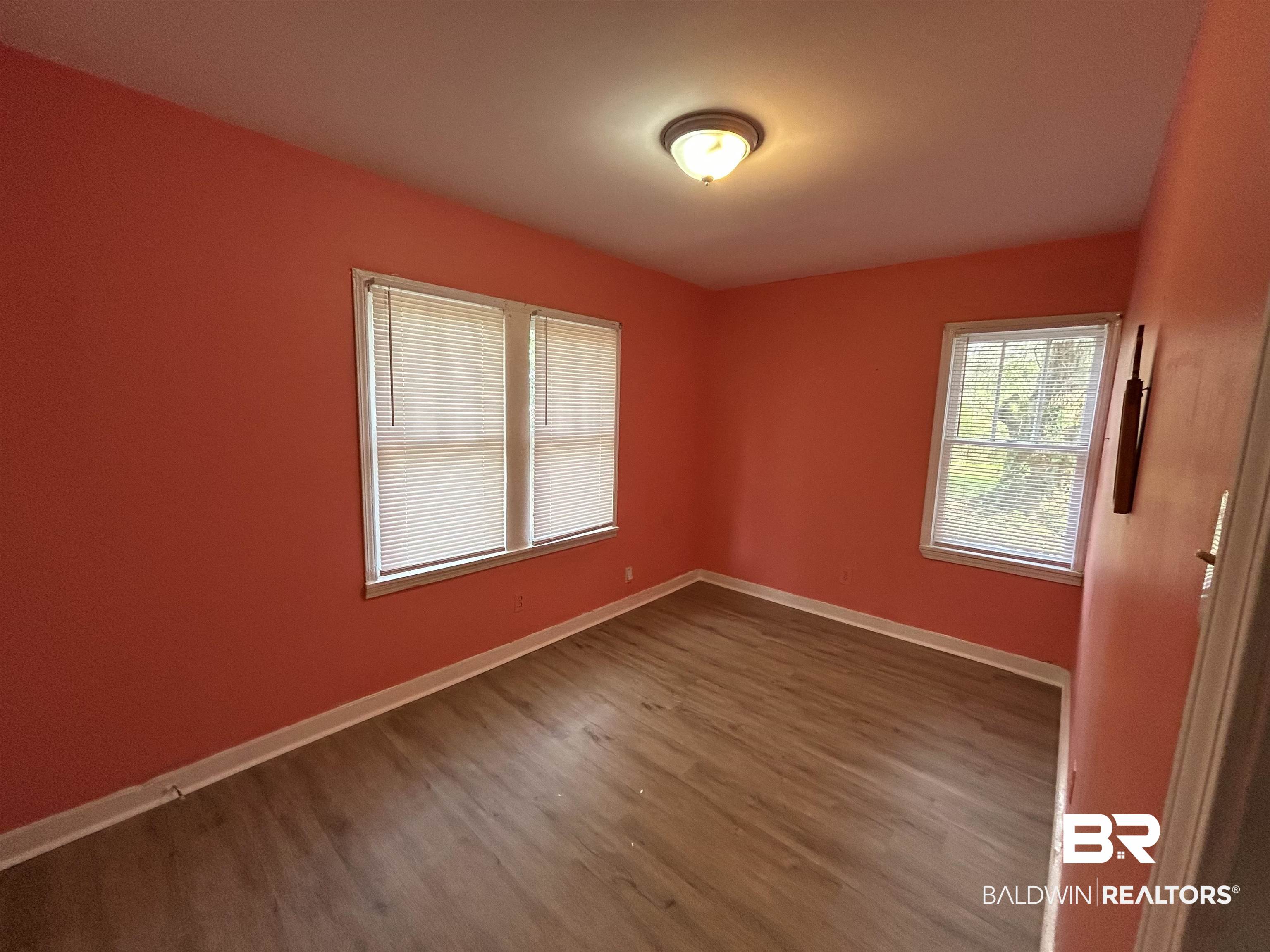 2119 Hoppin Street Mobile, AL 36605 - Photo 23 of 23 Unfurnished room featuring wood-type flooring
