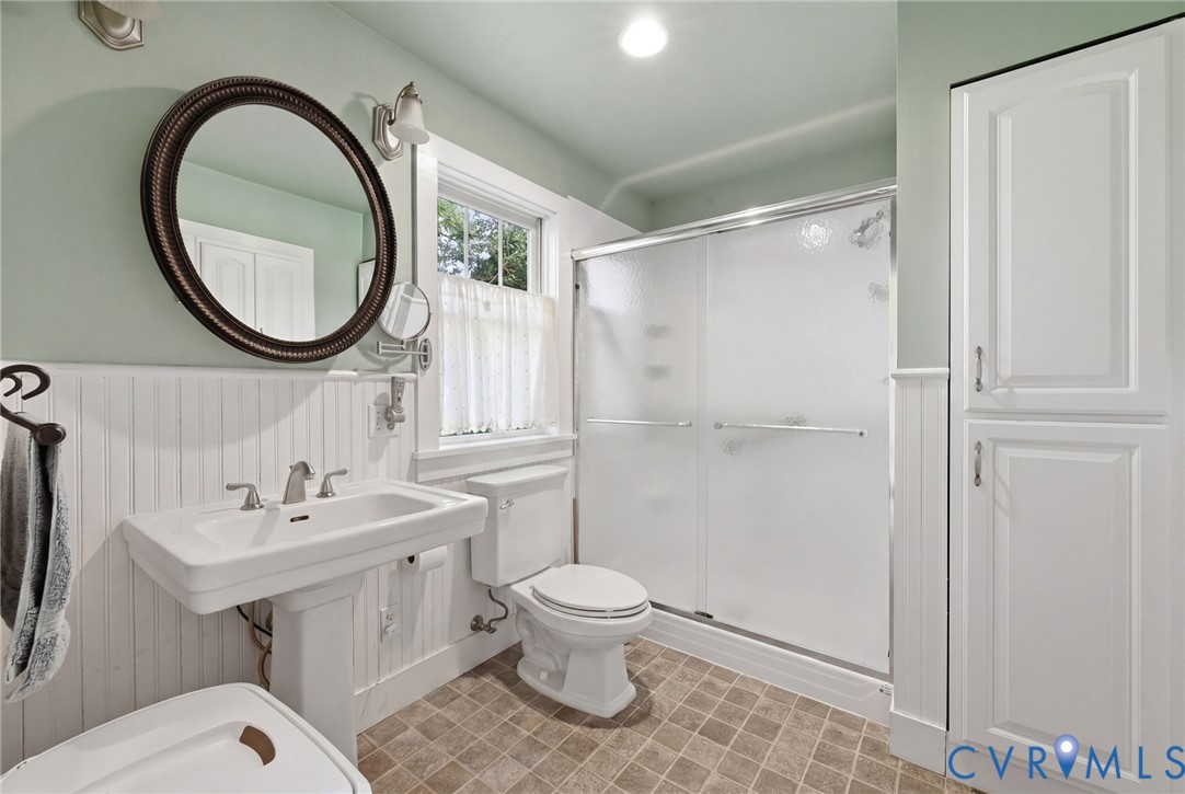 334 Pump Road New Canton, VA 23123 - Photo 14 of 74 a bathroom with a toilet a sink and a mirror