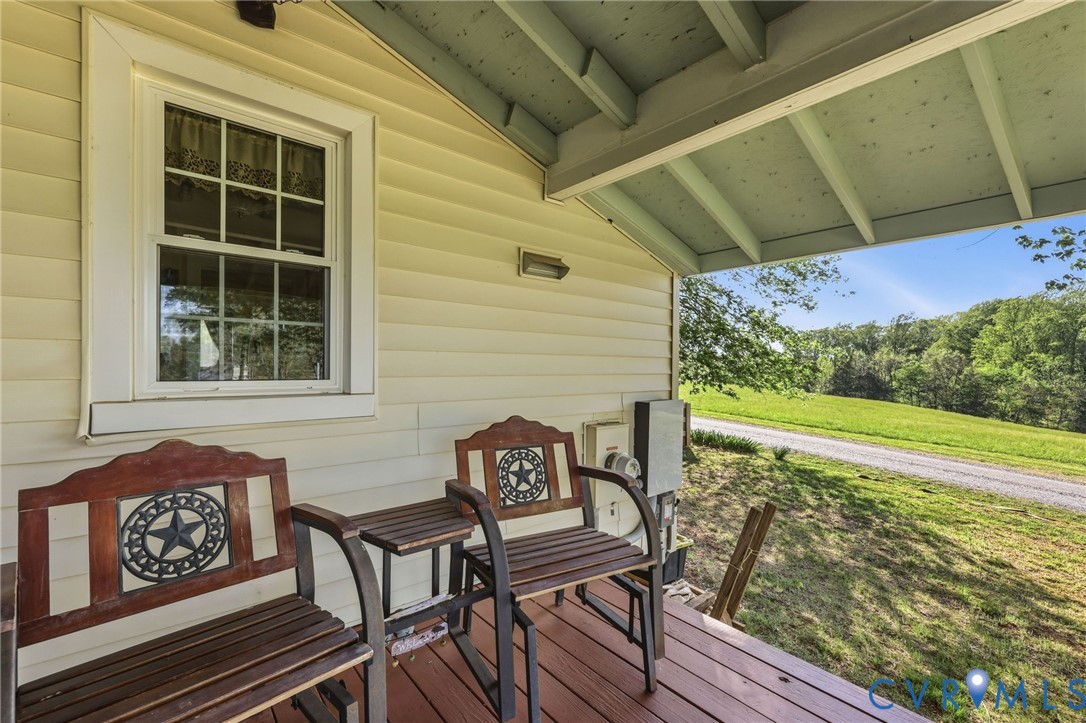 334 Pump Road New Canton, VA 23123 - Photo 17 of 74 a view of a chairs and table on the wooden floor