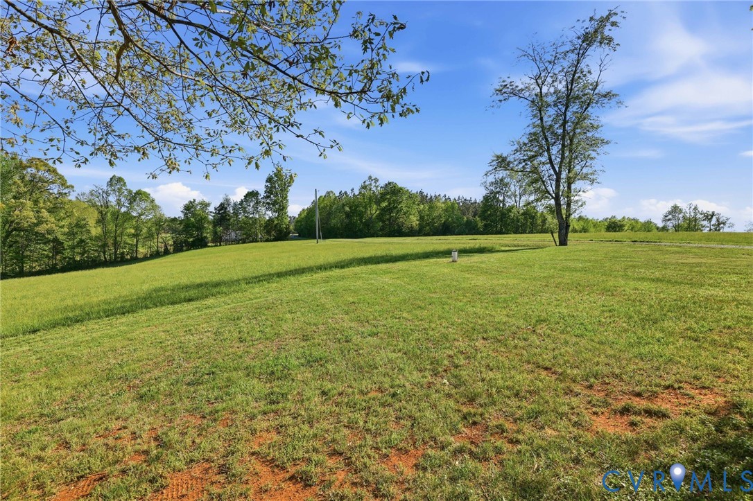334 Pump Road New Canton, VA 23123 - Photo 26 of 74 a view of a field with an trees