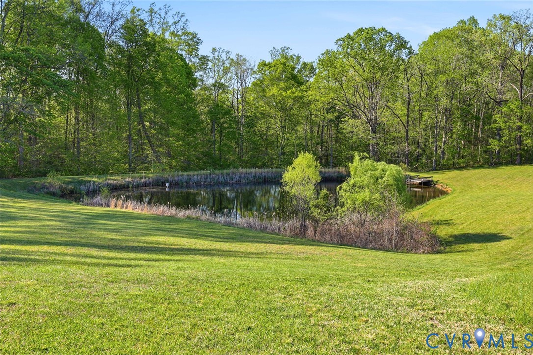 334 Pump Road New Canton, VA 23123 - Photo 30 of 74 a view of a golf course with a wooden fence