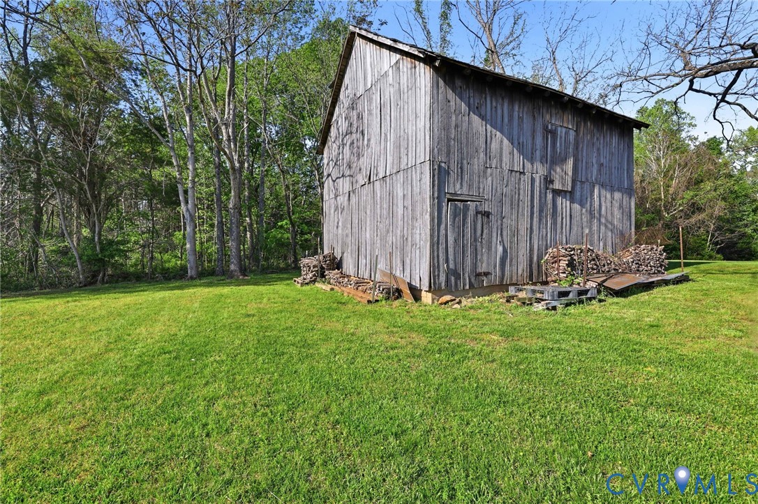 334 Pump Road New Canton, VA 23123 - Photo 40 of 74 a view of backyard with potted plants and large tree