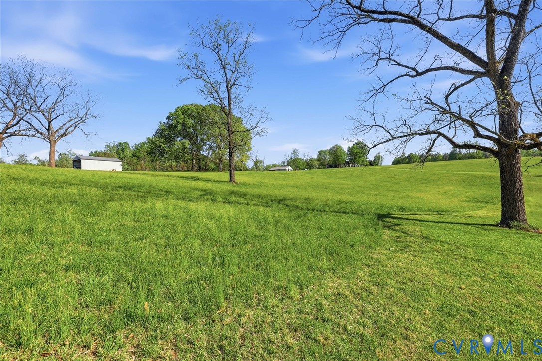 334 Pump Road New Canton, VA 23123 - Photo 46 of 74 a backyard of a house with lots of green space