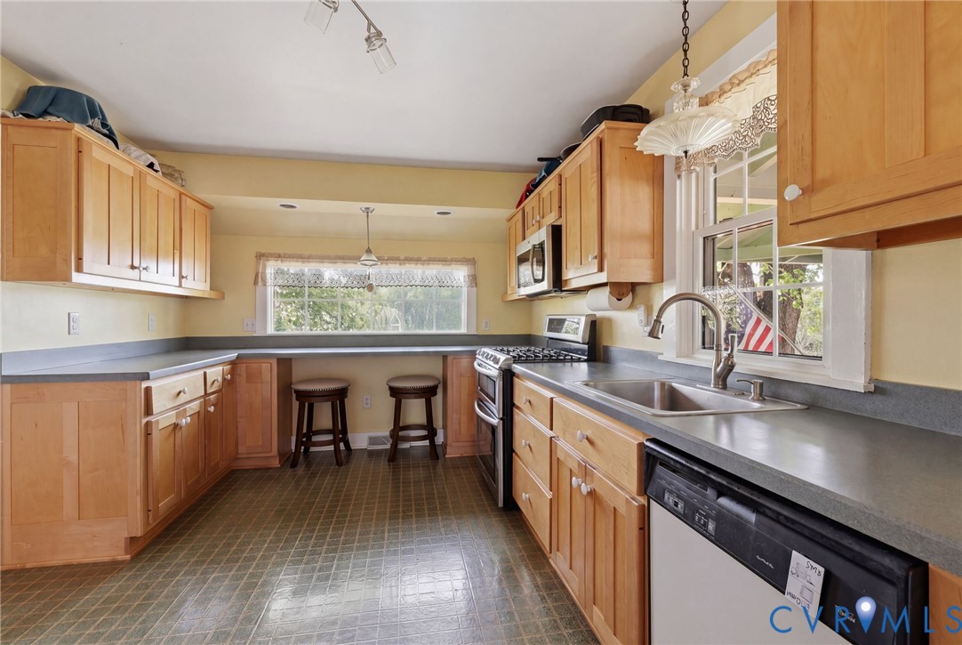 334 Pump Road New Canton, VA 23123 - Photo 10 of 74 a kitchen with sink cabinets and wooden floor