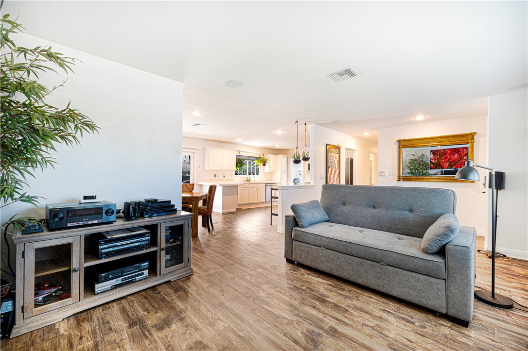 3542 Waco Avenue Simi Valley, CA 93063 - Photo 2 of 13 a living room with furniture and a flat screen tv