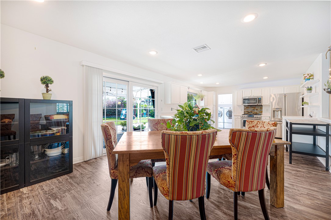 3542 Waco Avenue Simi Valley, CA 93063 - Photo 3 of 13 a view of a dining room with furniture and wooden floor