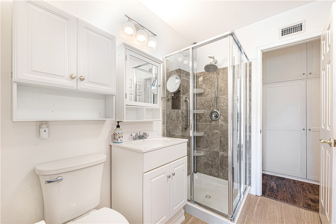 3542 Waco Avenue Simi Valley, CA 93063 - Photo 10 of 13 a bathroom with a shower a sink and a mirror