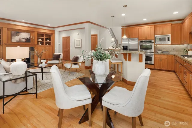 a view of a dining room with furniture window and wooden floor