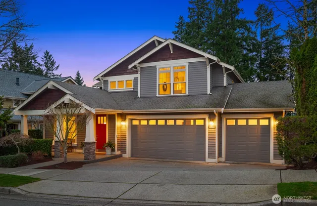 a front view of a house with garage