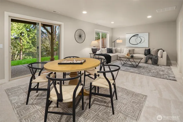 a dining room with furniture and window