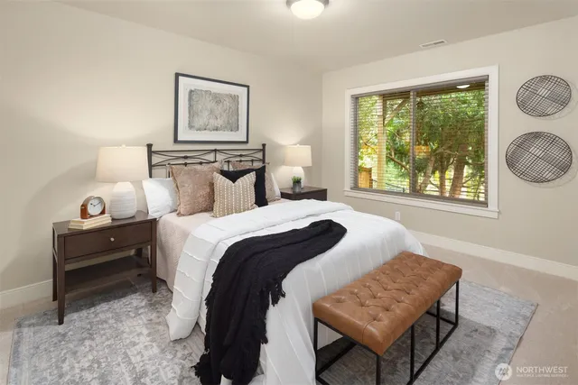 a bedroom with a bed and a window