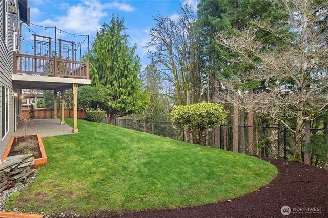 a view of a house with backyard porch and sitting area