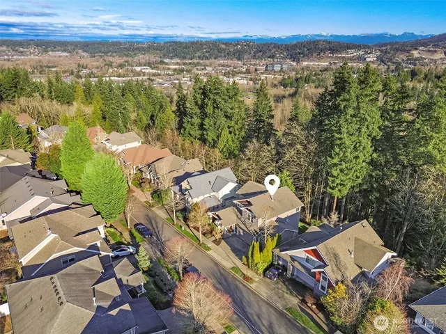 an aerial view of a residential houses with outdoor space