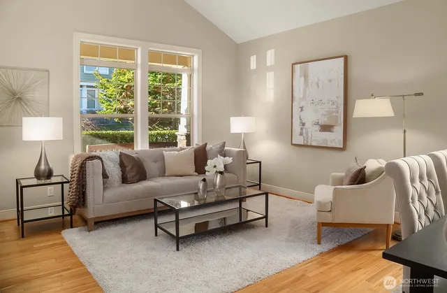 a living room with furniture and a large window