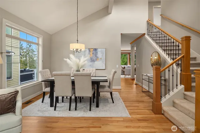 a view of a dining room with furniture window and wooden floor