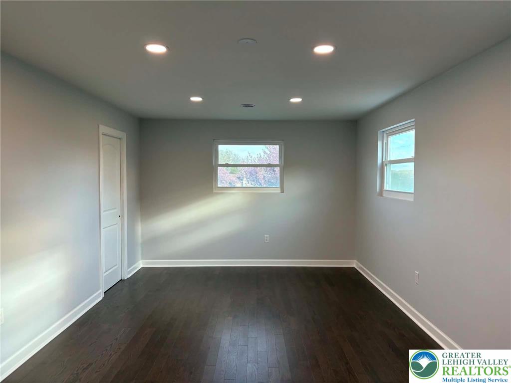 3957 Mountain Road Slatington, PA 18080 - Photo 13 of 33 an empty room with wooden floor and windows