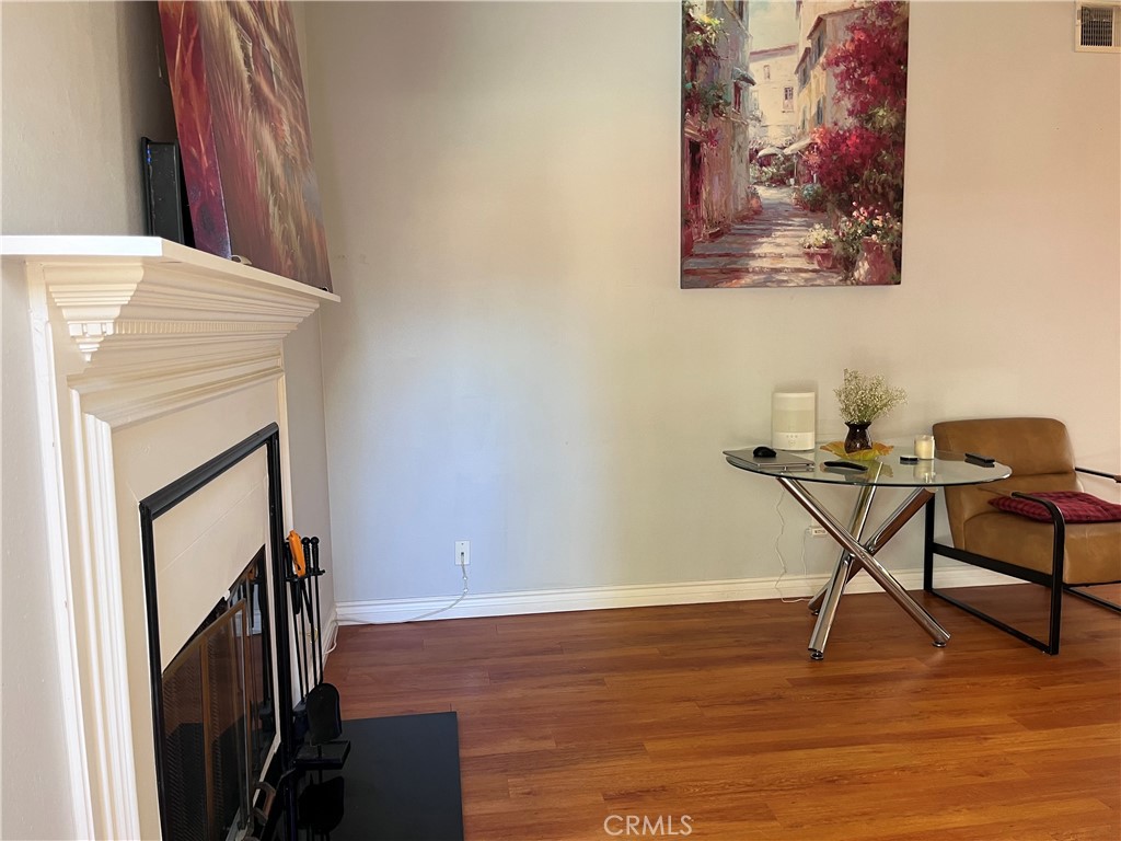 19849 Collins Road Canyon Country, CA 91351 - Photo 12 of 32 a workspace room with furniture and wooden floor