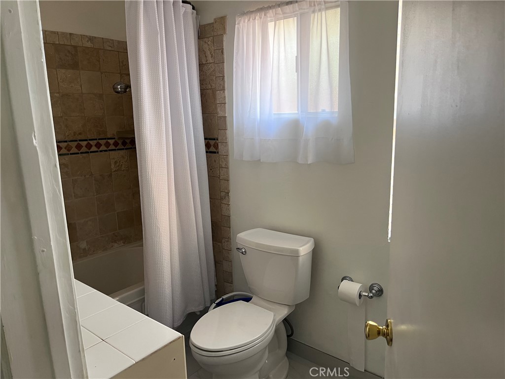 19849 Collins Road Canyon Country, CA 91351 - Photo 18 of 32 a white toilet sitting next to a shower