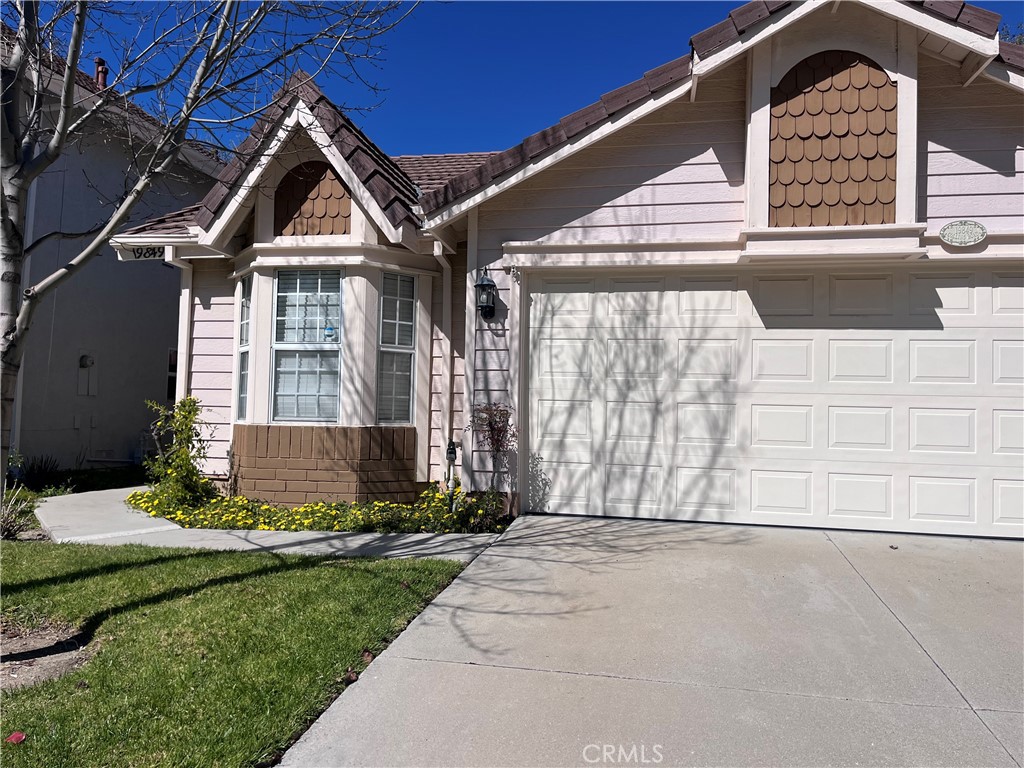 19849 Collins Road Canyon Country, CA 91351 - Photo 2 of 32 a front view of a house with a yard